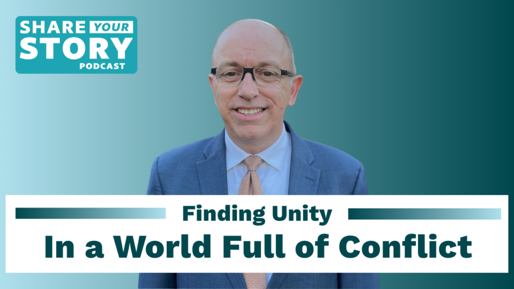 Podcast cover graphic for "Share Your Story Podcast" featuring Brandon Bigelow, a smiling man in glasses wearing a blue suit and tie, with the episode title "Finding Unity In a World Full of Conflict" displayed on a white banner below him.