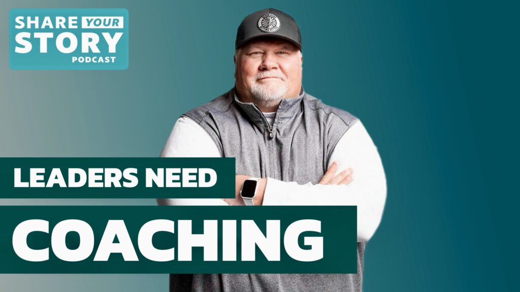 Photo of John Perry standing with arms crossed on the Share Your Story Podcast, author of Never Stop Getting Better and championship football coach.