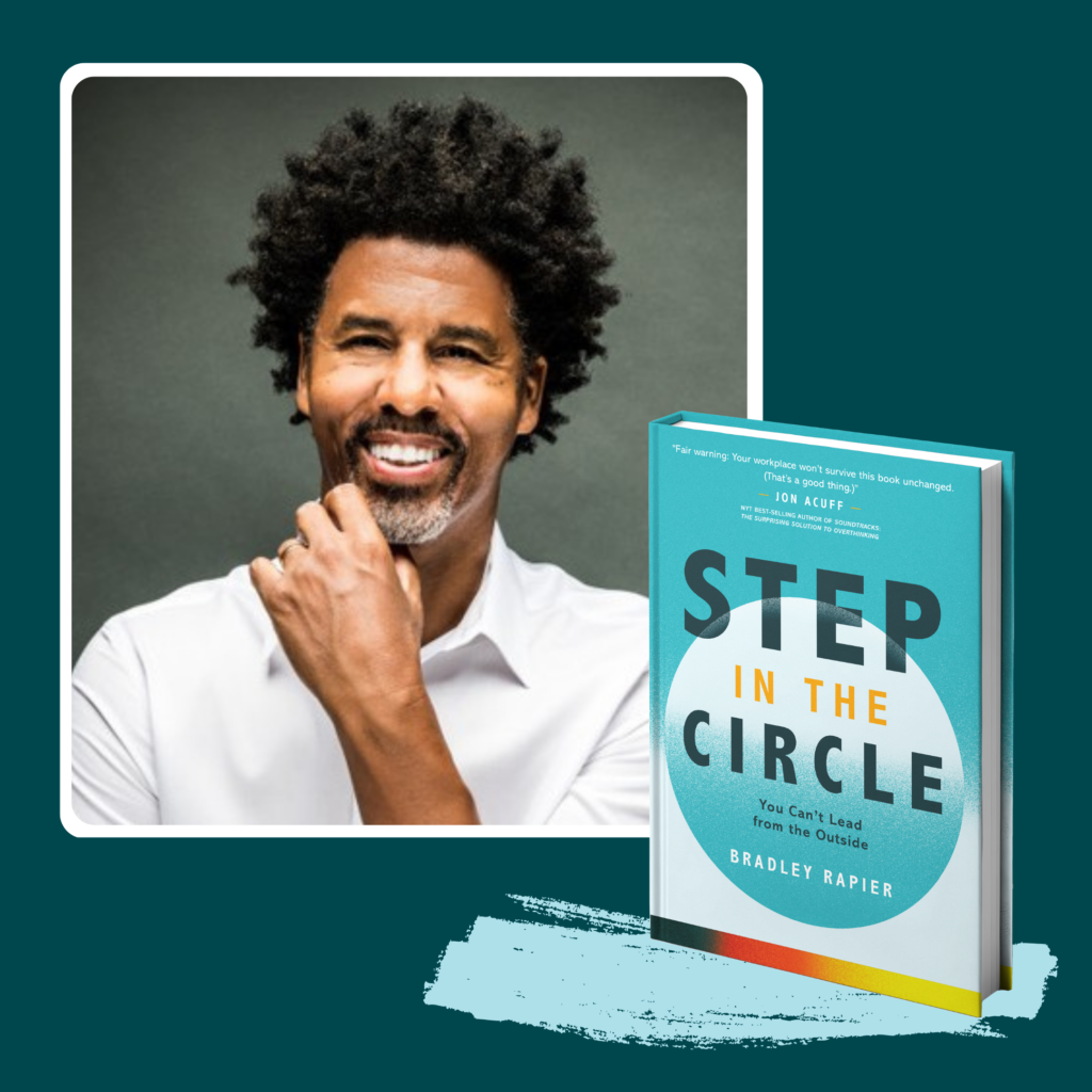 Photo of Bradley Rapier, author and keynote speaker, aside his freestyle leadership book Step In The Circle