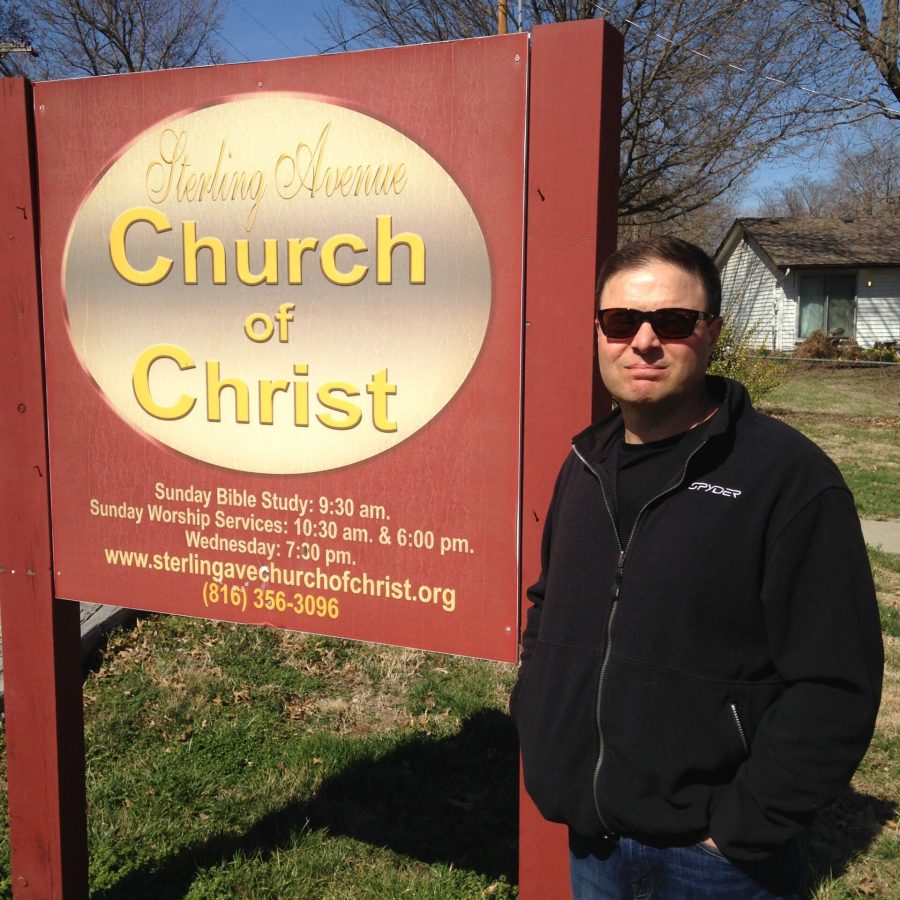 Photo of David Hockman in sunglasses and black jacket standing beside a Sterling Avenue Church of Christ sign, author writing about overcoming religious shame.